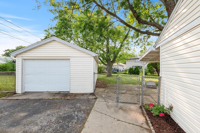 8928 S Ryan Rd, Hometown, IL 60456 - detached garage with a gate and asphalt driveway