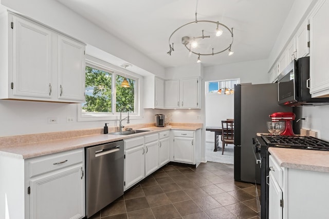 17889 W Elsbury St, Gurnee, IL 60031 - kitchen featuring stainless steel appliances, healthy amount of natural light, white cabinets, and light countertops