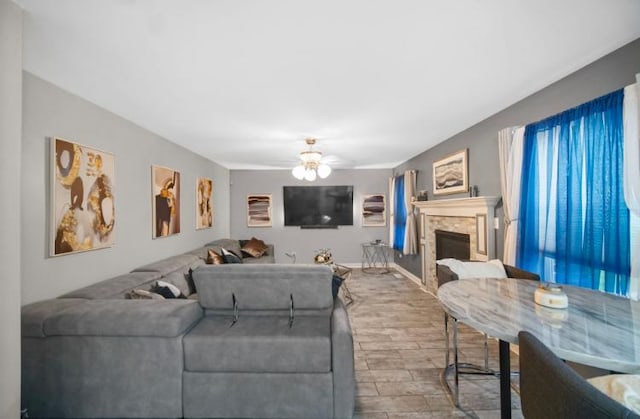 3105 Hermes Dr, Olympia Fields, IL 60461 - living area featuring wood finished floors, a stone fireplace, and ceiling fan