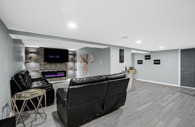 3105 Hermes Dr, Olympia Fields, IL 60461 - living room with light wood-style flooring, recessed lighting, and a glass covered fireplace