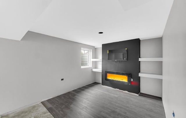 3105 Hermes Dr, Olympia Fields, IL 60461 - unfurnished living room featuring a lit fireplace and wood finished floors