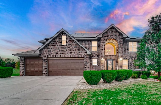 3105 Hermes Dr, Olympia Fields, IL 60461 - traditional-style house with brick siding, solar panels, a garage, and driveway