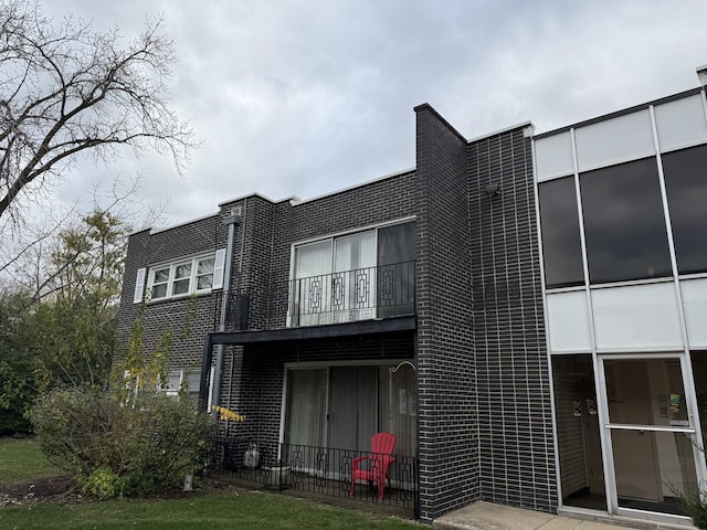 18330 Cherry Creek Dr Unit 5, Homewood, IL 60430 - rear view of house featuring a balcony and brick siding