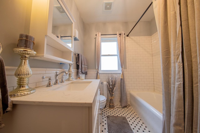 10215 S Charles St, Chicago, IL 60643 - full bath featuring shower / bath combination with curtain, tile walls, vanity, a wainscoted wall, and tile patterned floors