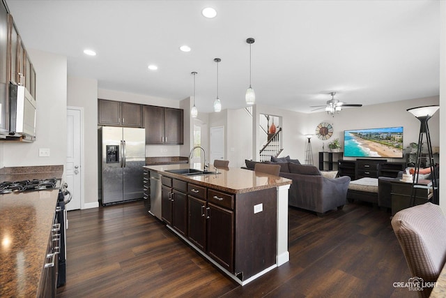 1133 Daytona Way, Pingree Grove, IL 60140 - kitchen with stainless steel appliances, open floor plan, dark brown cabinets, dark wood-style floors, and recessed lighting