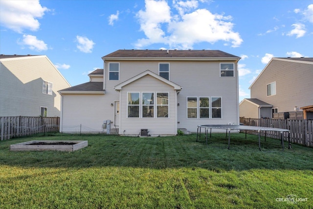 1133 Daytona Way, Pingree Grove, IL 60140 - rear view of house featuring a trampoline and a fenced backyard