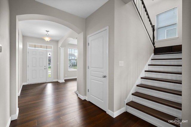 1133 Daytona Way, Pingree Grove, IL 60140 - entryway with arched walkways, dark wood-type flooring, and stairs