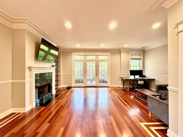 818 W Aldine Ave Unit 3, Chicago, IL 60657 - unfurnished living room with crown molding, a tiled fireplace, wood finished floors, and recessed lighting