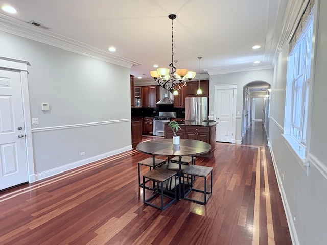 818 W Aldine Ave Unit 3, Chicago, IL 60657 - dining room featuring arched walkways, dark wood finished floors, recessed lighting, a chandelier, and ornamental molding