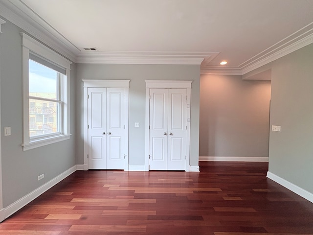 818 W Aldine Ave Unit 3, Chicago, IL 60657 - unfurnished bedroom with multiple closets, recessed lighting, wood finished floors, and crown molding