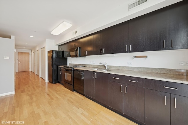 1740 Oak Ave Unit 103, Evanston, IL 60201 - kitchen featuring black appliances, light wood-style flooring, recessed lighting, and dark brown cabinets