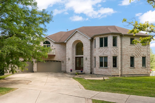 2308 Fleetwood Ct, Naperville, IL 60565 - view of front of home featuring an attached garage, concrete driveway, a balcony, a front yard, and brick siding