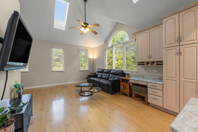 2308 Fleetwood Ct, Naperville, IL 60565 - living room with a skylight, a ceiling fan, light wood-type flooring, and high vaulted ceiling