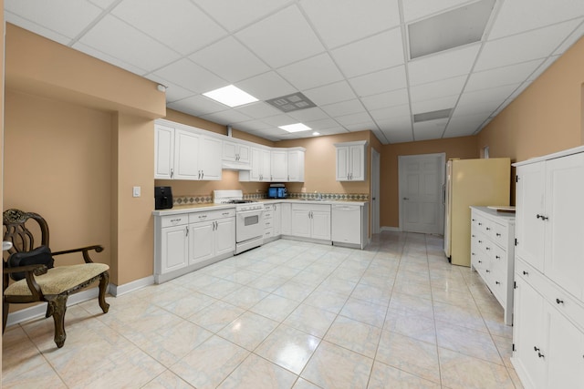 2308 Fleetwood Ct, Naperville, IL 60565 - kitchen with white appliances, a drop ceiling, light countertops, and white cabinets
