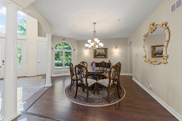 2308 Fleetwood Ct, Naperville, IL 60565 - dining room featuring arched walkways, decorative columns, wood finished floors, recessed lighting, and a chandelier