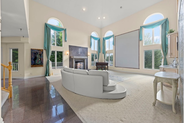 2308 Fleetwood Ct, Naperville, IL 60565 - living area featuring a towering ceiling, plenty of natural light, a warm lit fireplace, granite tiled floors, and recessed lighting