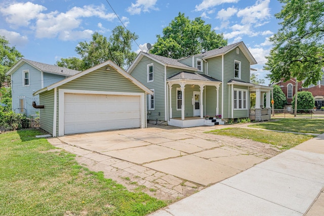 528 E Benton St, Aurora, IL 60505 - traditional-style house featuring covered porch, concrete driveway, and a garage