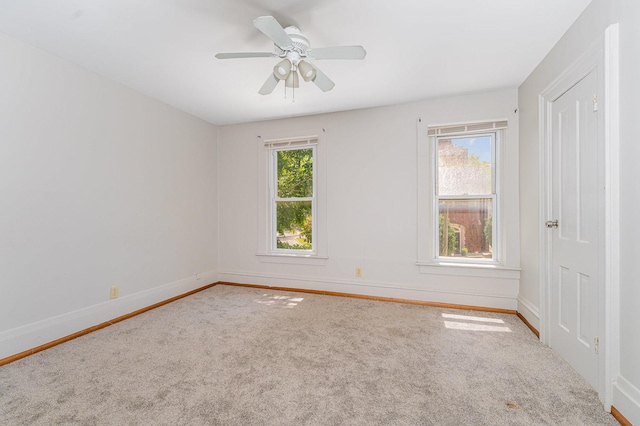 528 E Benton St, Aurora, IL 60505 - carpeted empty room featuring baseboards and a ceiling fan