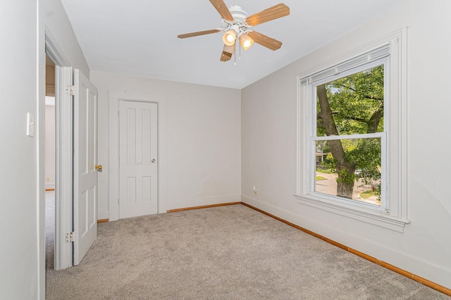 528 E Benton St, Aurora, IL 60505 - unfurnished bedroom with carpet flooring and ceiling fan
