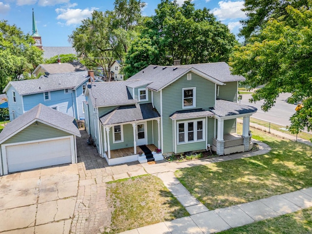 528 E Benton St, Aurora, IL 60505 - view of front facade with covered porch, roof with shingles, a front lawn, and a chimney