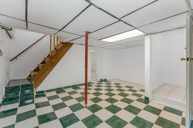 528 E Benton St, Aurora, IL 60505 - finished basement featuring stairs, tile patterned floors, and a paneled ceiling