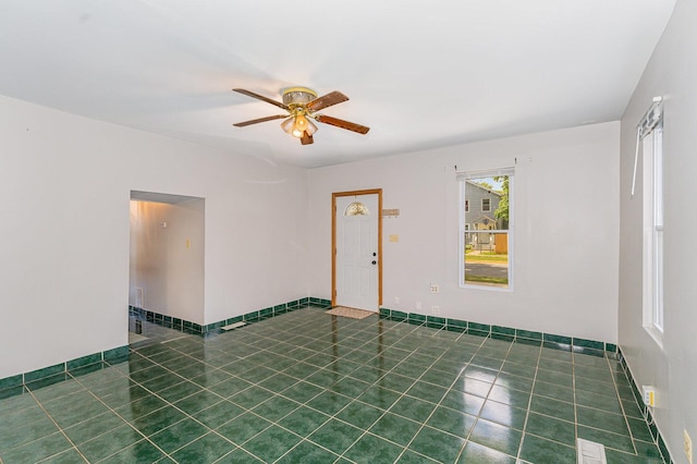 528 E Benton St, Aurora, IL 60505 - spare room featuring a ceiling fan and tile patterned floors