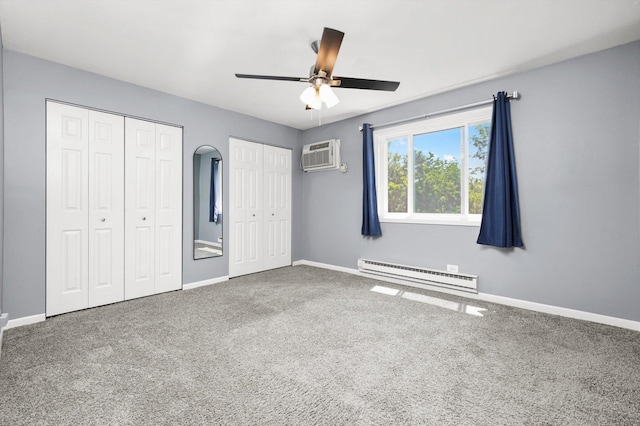 5701 W 129th St Unit 2B, Crestwood, IL 60418 - unfurnished bedroom with a baseboard heating unit, two closets, carpet, an AC wall unit, and ceiling fan