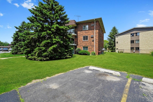 5701 W 129th St Unit 2B, Crestwood, IL 60418 - view of building exterior featuring uncovered parking