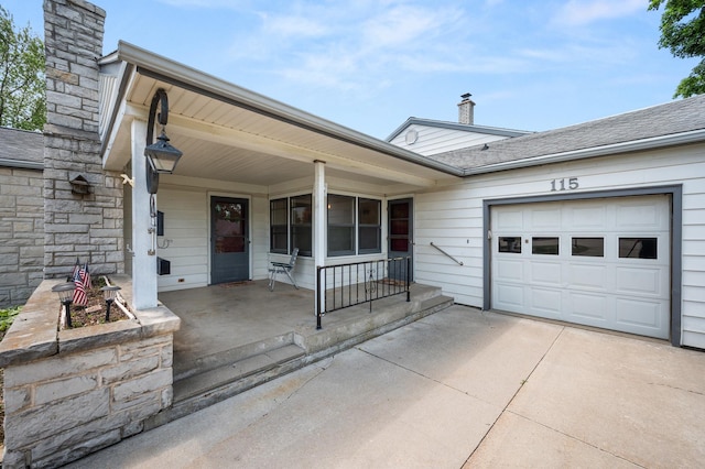 115 Fair St, Sycamore, IL 60178 - view of front of home featuring a porch, a chimney, concrete driveway, an attached garage, and roof with shingles