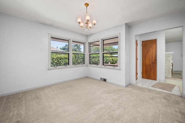 115 Fair St, Sycamore, IL 60178 - spare room featuring a chandelier and carpet floors