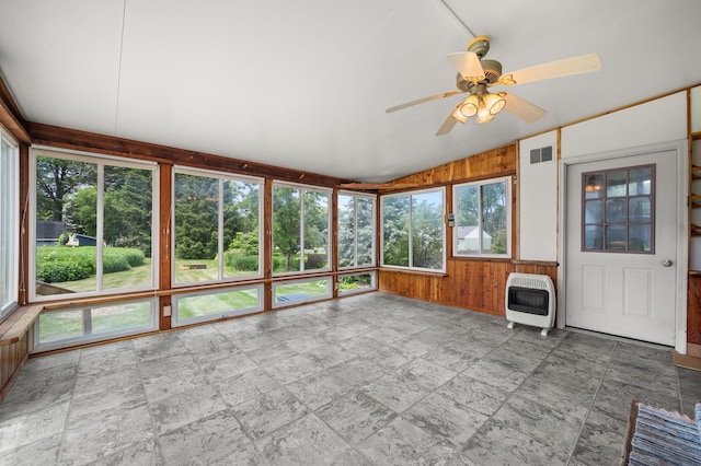 115 Fair St, Sycamore, IL 60178 - unfurnished sunroom with heating unit, lofted ceiling, stone tile flooring, and wooden walls