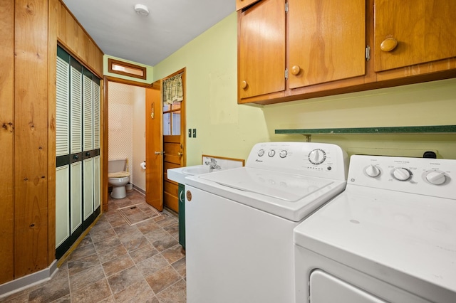 115 Fair St, Sycamore, IL 60178 - washroom featuring washing machine and clothes dryer, stone finish floors, and cabinet space