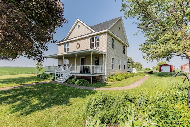 4116 E 13th Rd, Earlville, IL 60518 - view of front of house featuring covered porch and a front lawn