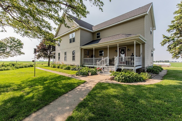 4116 E 13th Rd, Earlville, IL 60518 - view of front of home featuring a porch, a front lawn, and a shingled roof