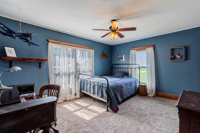 4116 E 13th Rd, Earlville, IL 60518 - bedroom featuring carpet floors, a textured ceiling, a desk, and a ceiling fan