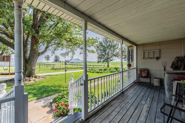 4116 E 13th Rd, Earlville, IL 60518 - wooden porch with a yard and a view of countryside