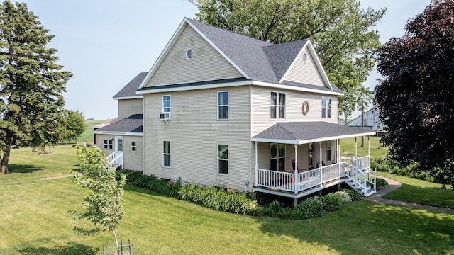 4116 E 13th Rd, Earlville, IL 60518 - view of side of property featuring covered porch, roof with shingles, and a lawn