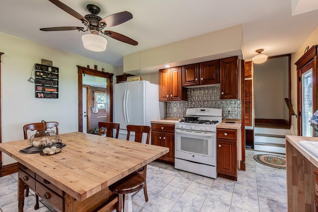4116 E 13th Rd, Earlville, IL 60518 - kitchen featuring white appliances, tasteful backsplash, light countertops, and a ceiling fan