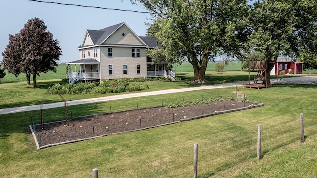 4116 E 13th Rd, Earlville, IL 60518 - view of grassy yard with a vegetable garden