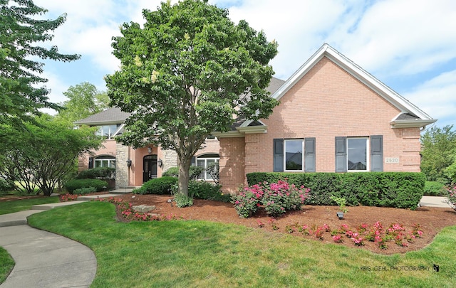 2520 Hanford Ln, Aurora, IL 60502 - view of front facade with a front yard and brick siding