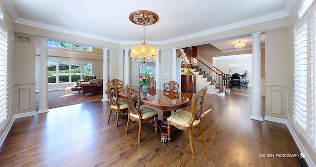 2520 Hanford Ln, Aurora, IL 60502 - dining space with a chandelier, ornate columns, dark wood-type flooring, ornamental molding, and a wainscoted wall