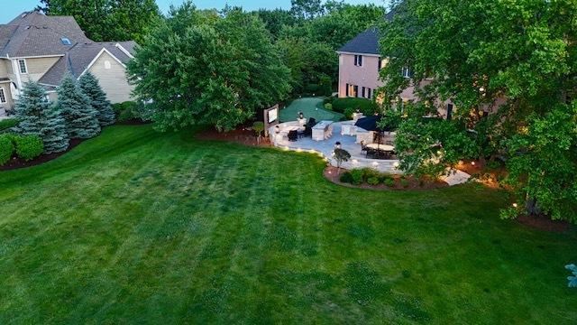 2520 Hanford Ln, Aurora, IL 60502 - view of green lawn with a patio