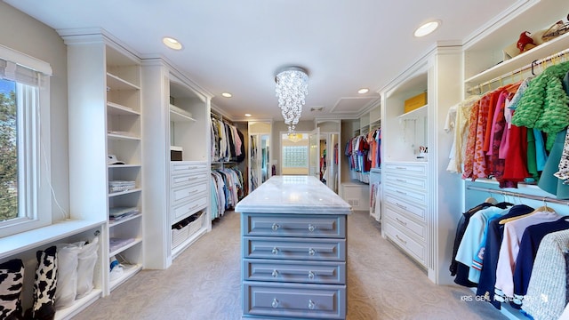 2520 Hanford Ln, Aurora, IL 60502 - walk in closet with light carpet and a chandelier