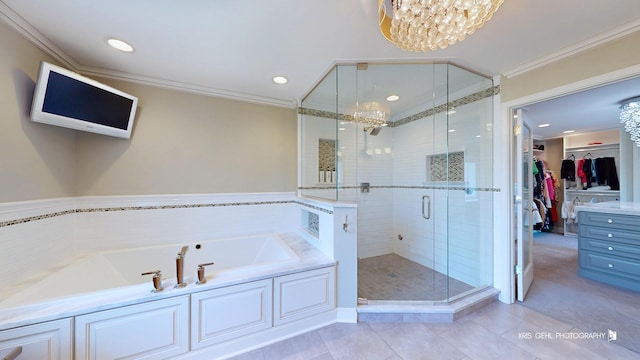 2520 Hanford Ln, Aurora, IL 60502 - full bathroom with a chandelier, a garden tub, a stall shower, tile patterned flooring, and a walk in closet