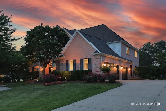 2520 Hanford Ln, Aurora, IL 60502 - traditional-style home featuring driveway, a lawn, and brick siding