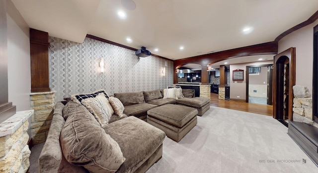 2520 Hanford Ln, Aurora, IL 60502 - living area with ornate columns, ornamental molding, arched walkways, wallpapered walls, and light colored carpet