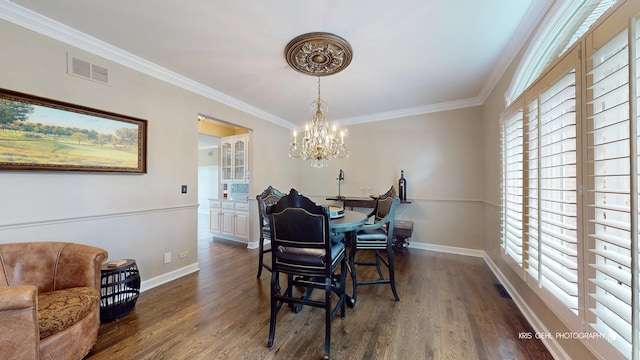 2520 Hanford Ln, Aurora, IL 60502 - dining space with dark wood finished floors, ornamental molding, and a chandelier