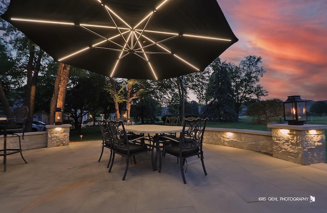 2520 Hanford Ln, Aurora, IL 60502 - patio terrace at dusk with a patio area and outdoor dining space