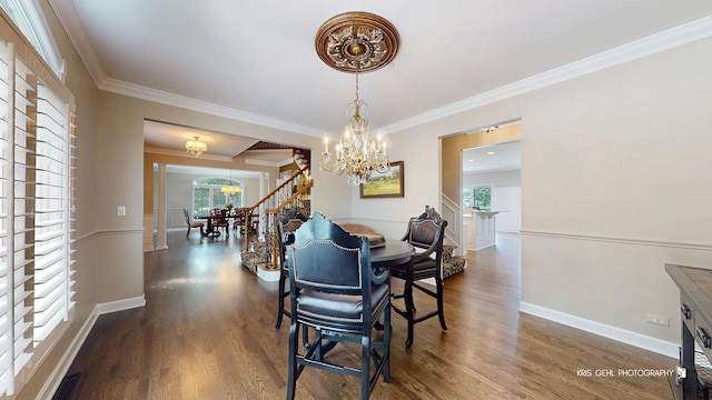 2520 Hanford Ln, Aurora, IL 60502 - dining area with a chandelier, plenty of natural light, dark wood-type flooring, and ornamental molding