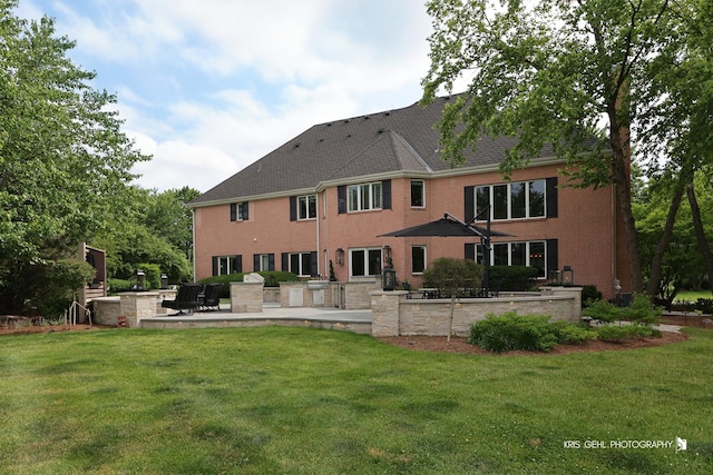 2520 Hanford Ln, Aurora, IL 60502 - back of house featuring a patio area and a yard